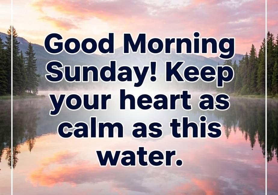 "A serene mountain lake reflecting pink and gold sunrise sky clouds, framed by pine trees on either side and a thin white border. Large dark navy text at the center says 'Good Morning Sunday! Keep your heart as calm as this water.' above 'tastimer.com' at the bottom."